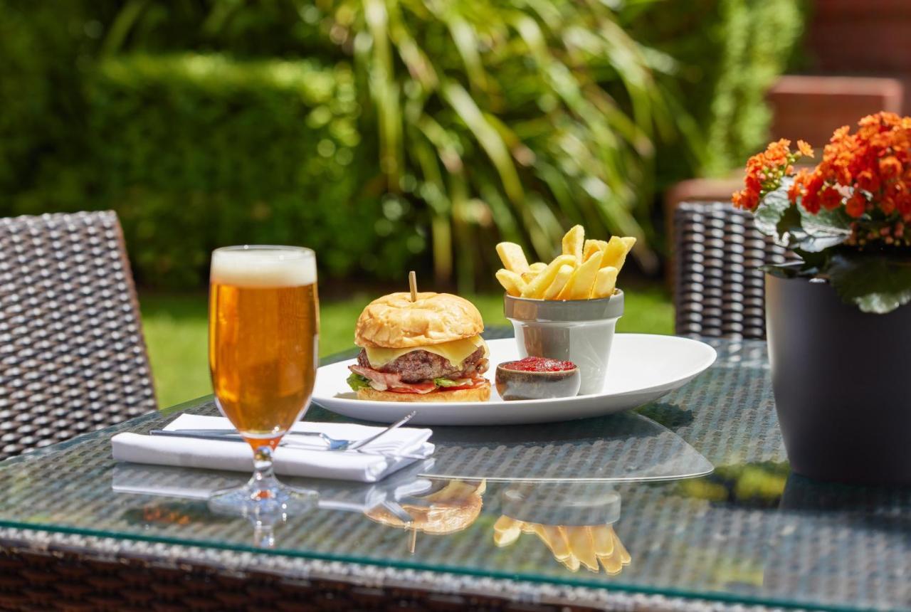 Hyatt Hotel Canberra - A Park Hyatt Hotel Exterior photo A burger and chips served with a beer